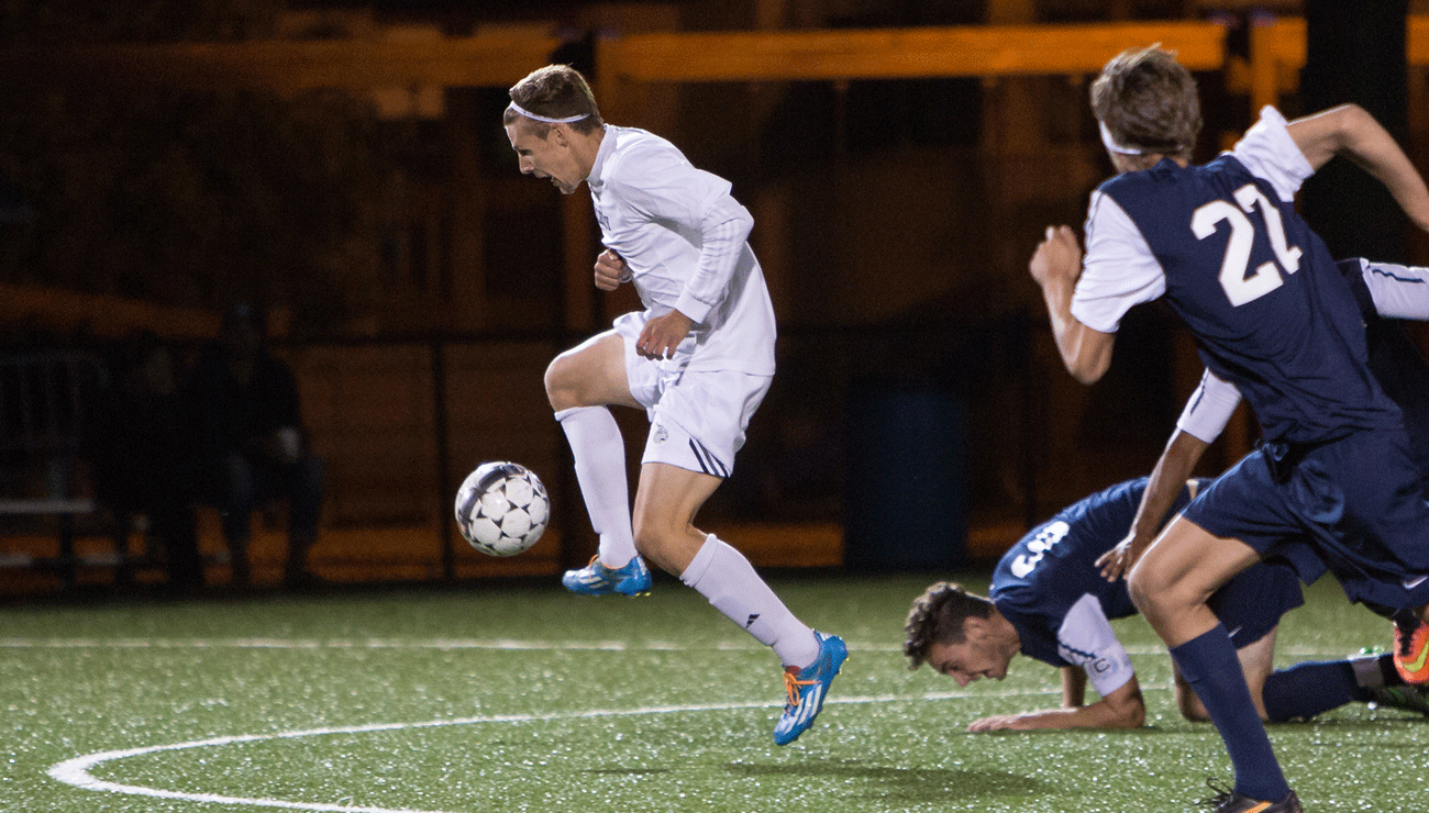 Men's Soccer Downs Regis on the Road for First NECC Win
